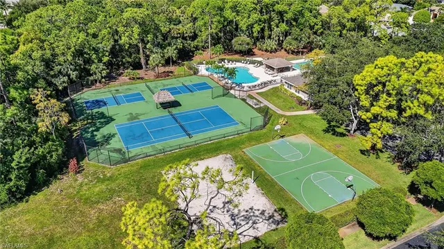 a view of a swimming pool with a yard