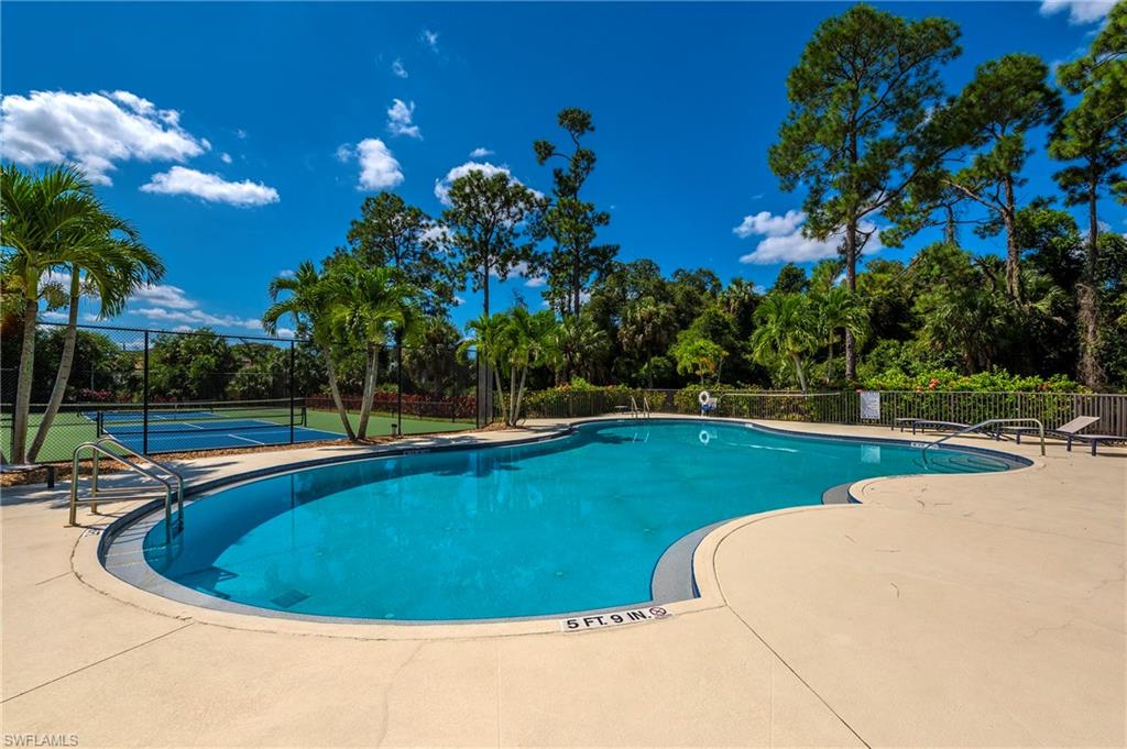 2039 Terrazzo Lane Naples, FL 34104 - Photo 28 of 29 a view of a swimming pool with a yard