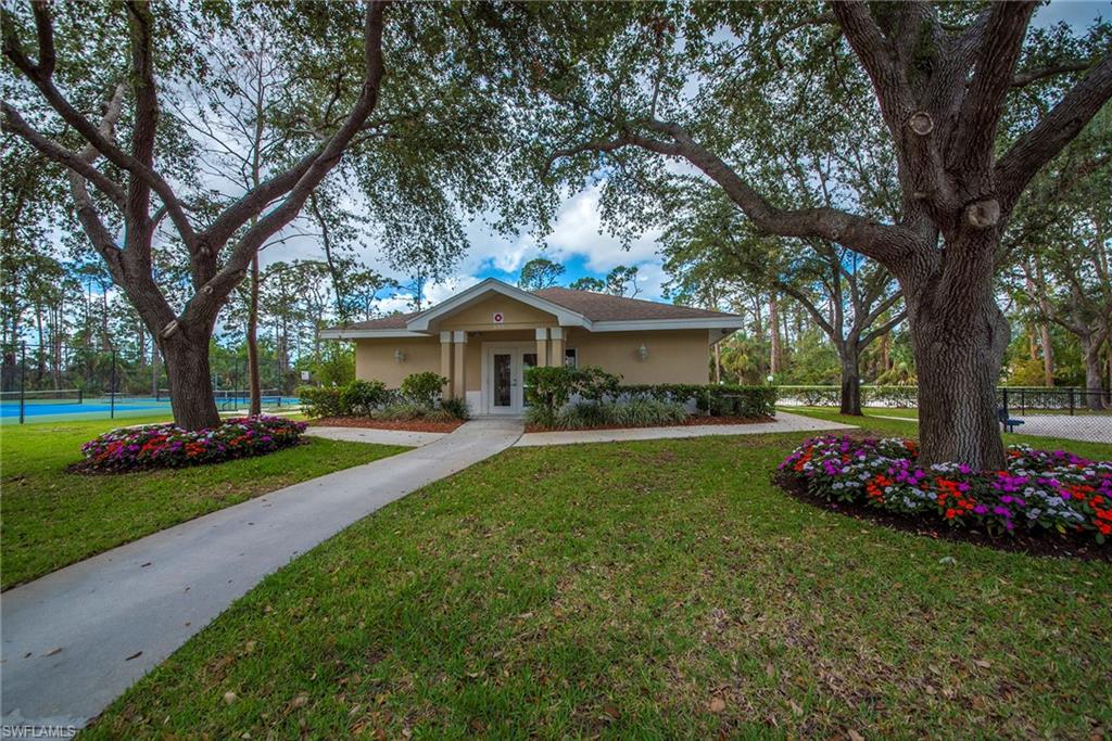 2039 Terrazzo Lane Naples, FL 34104 - Photo 29 of 29 a front view of a house with garden