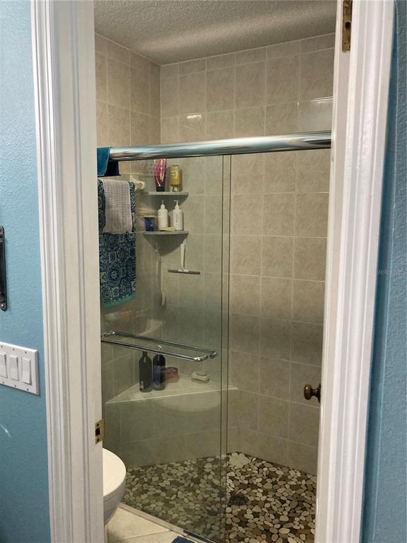 8101 Roxboro Drive Hudson, FL 34667 - Photo 17 of 47 a bathroom with a shower