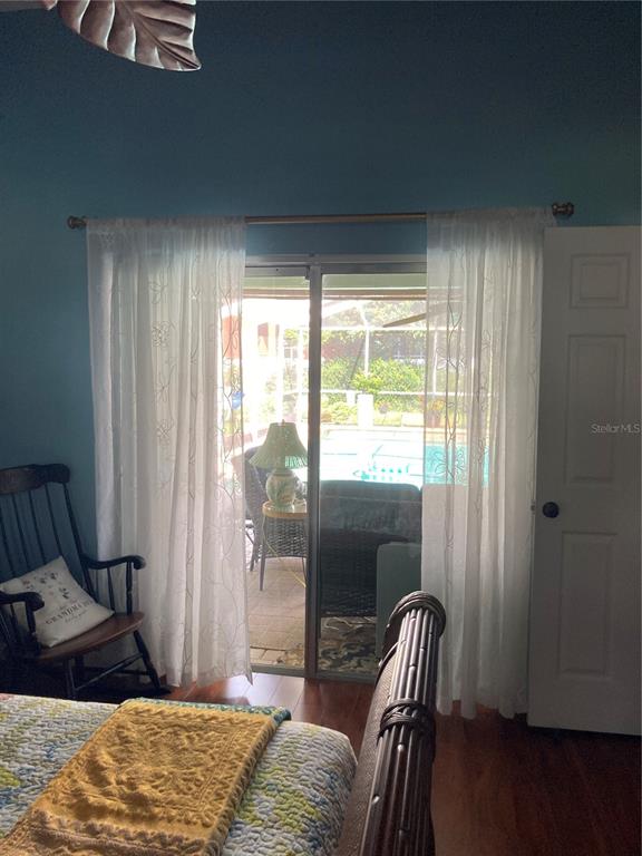 8101 Roxboro Drive Hudson, FL 34667 - Photo 18 of 47 a bedroom with a bed and a window