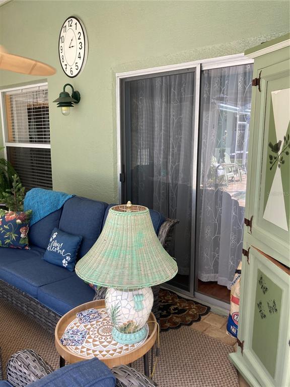 8101 Roxboro Drive Hudson, FL 34667 - Photo 32 of 47 a living room with furniture and a table