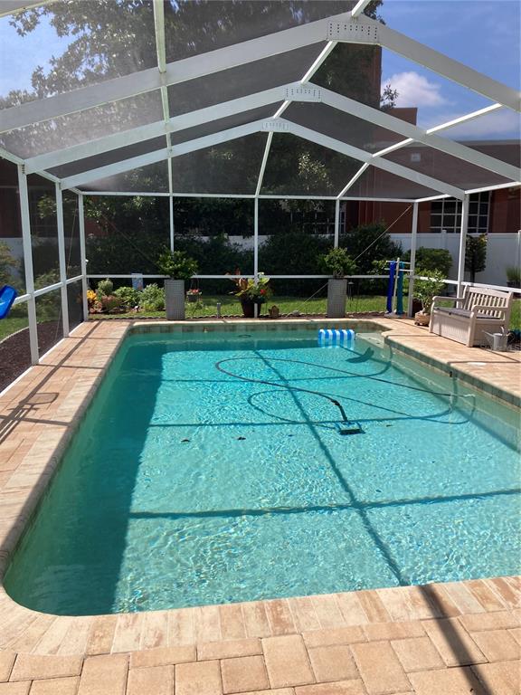 8101 Roxboro Drive Hudson, FL 34667 - Photo 35 of 47 a view of a swimming pool with sitting area