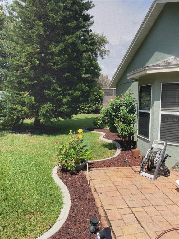 8101 Roxboro Drive Hudson, FL 34667 - Photo 39 of 47 a view of a backyard with sitting area