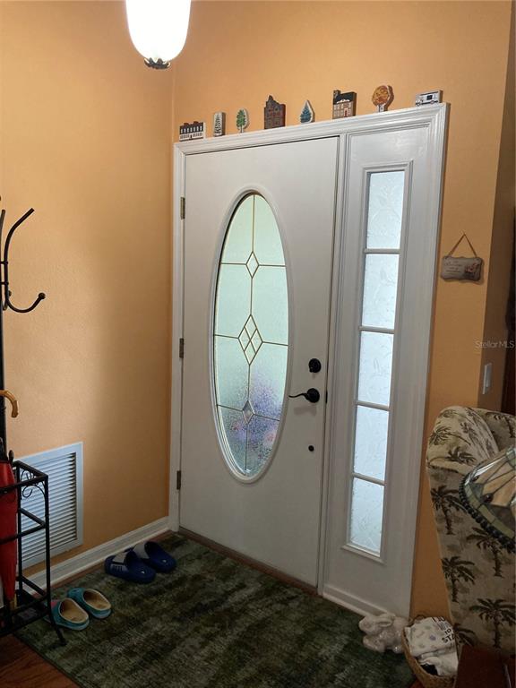 8101 Roxboro Drive Hudson, FL 34667 - Photo 4 of 47 a view of a livingroom with wooden floor and a sink
