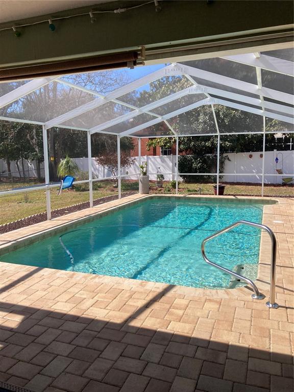 8101 Roxboro Drive Hudson, FL 34667 - Photo 44 of 47 a view of a house with backyard porch and sitting area
