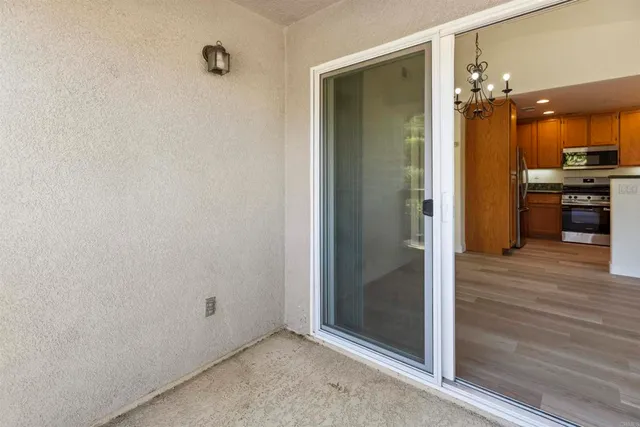 a view of a hallway with dining area