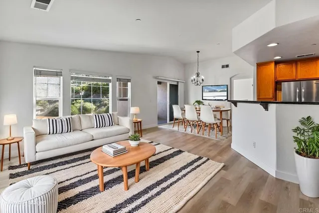 a living room with furniture and a table