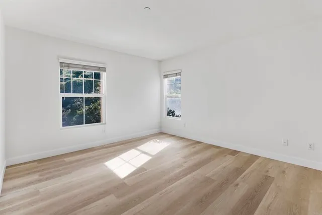 a bedroom with bed and window