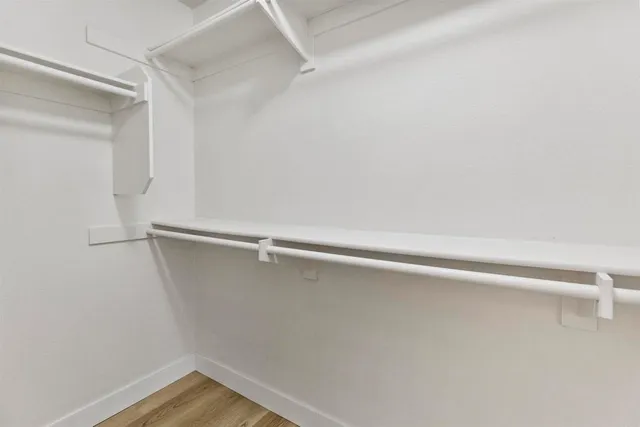 a bathroom with a granite countertop sink mirror and a bath tub