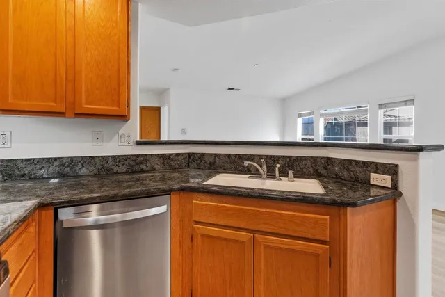 a kitchen with a sink and cabinets