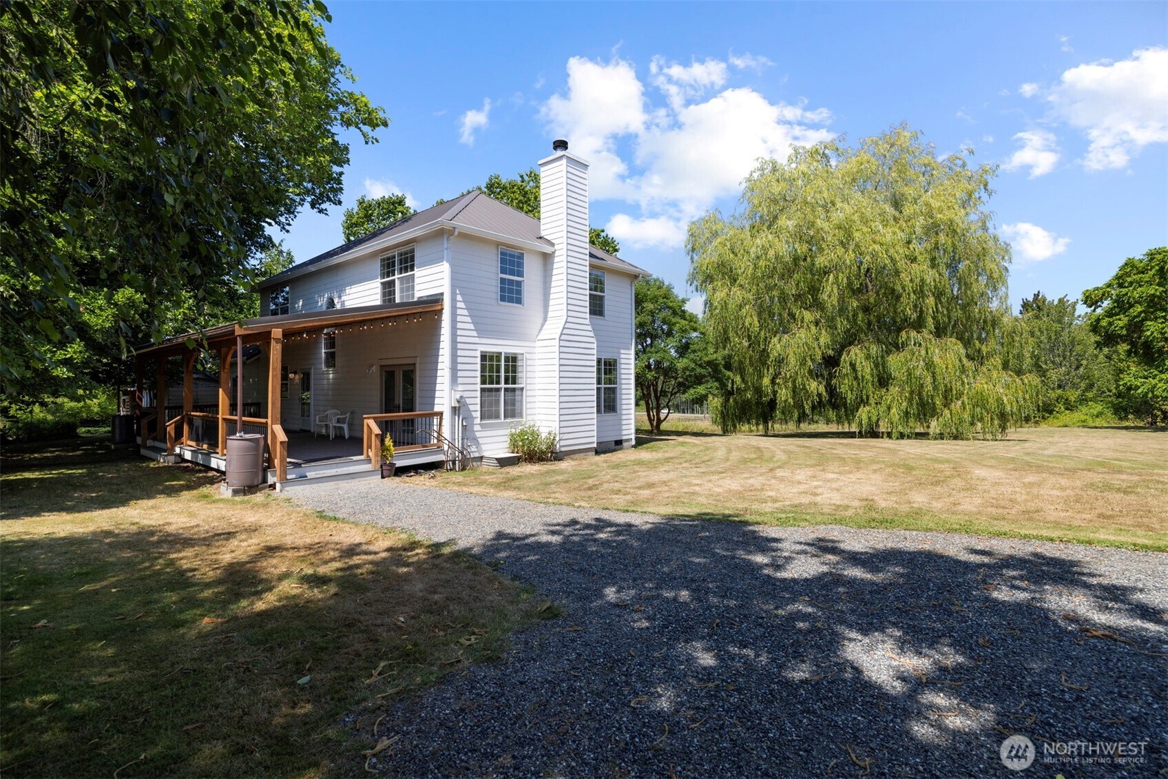 299 East Axton Road Bellingham, WA 98226 - Photo 1 of 40 a view of a house with backyard and sitting area