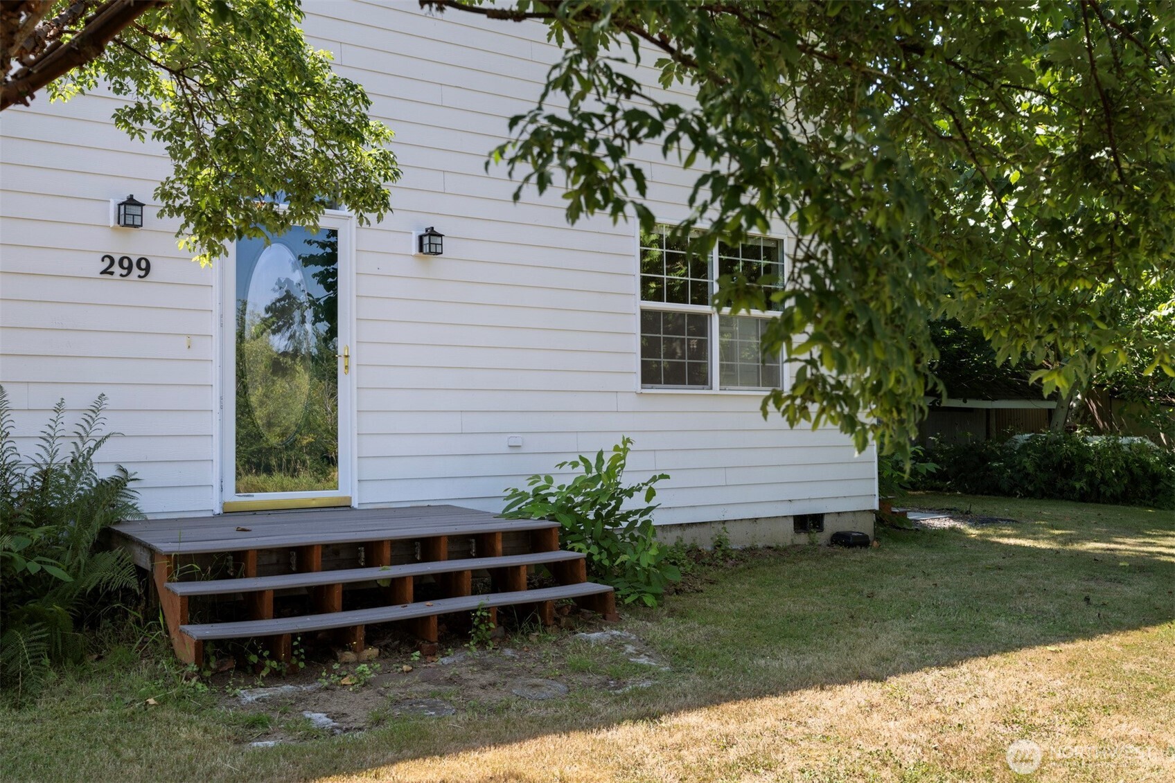 299 East Axton Road Bellingham, WA 98226 - Photo 12 of 40 a view of a wooden bench sitting in the yard