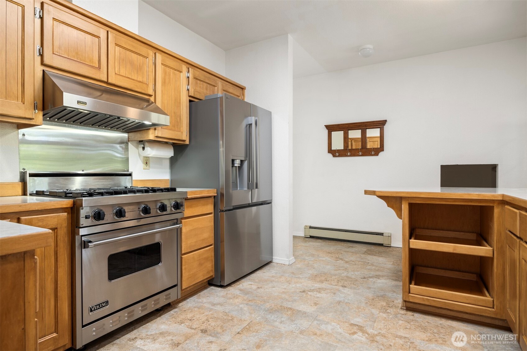 299 East Axton Road Bellingham, WA 98226 - Photo 29 of 40 a kitchen with stainless steel appliances a stove and a refrigerator