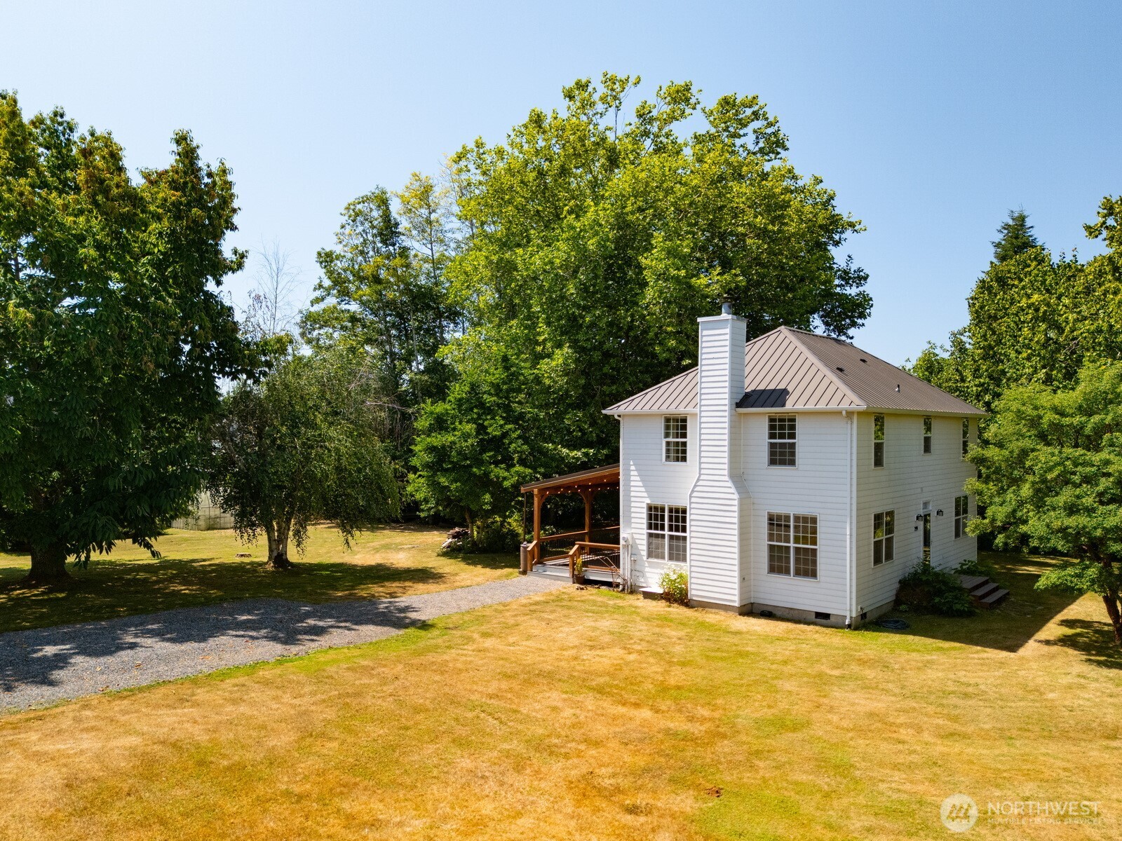 299 East Axton Road Bellingham, WA 98226 - Photo 3 of 40 a view of a white house with a yard