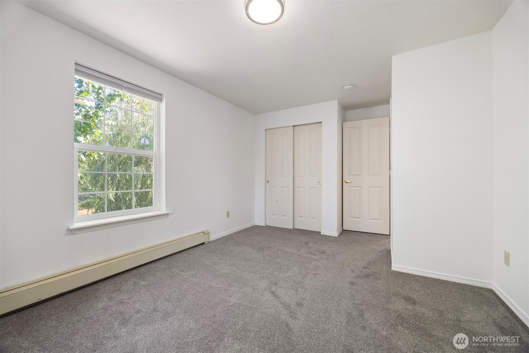 299 East Axton Road Bellingham, WA 98226 - Photo 36 of 40 an empty room with windows and closet
