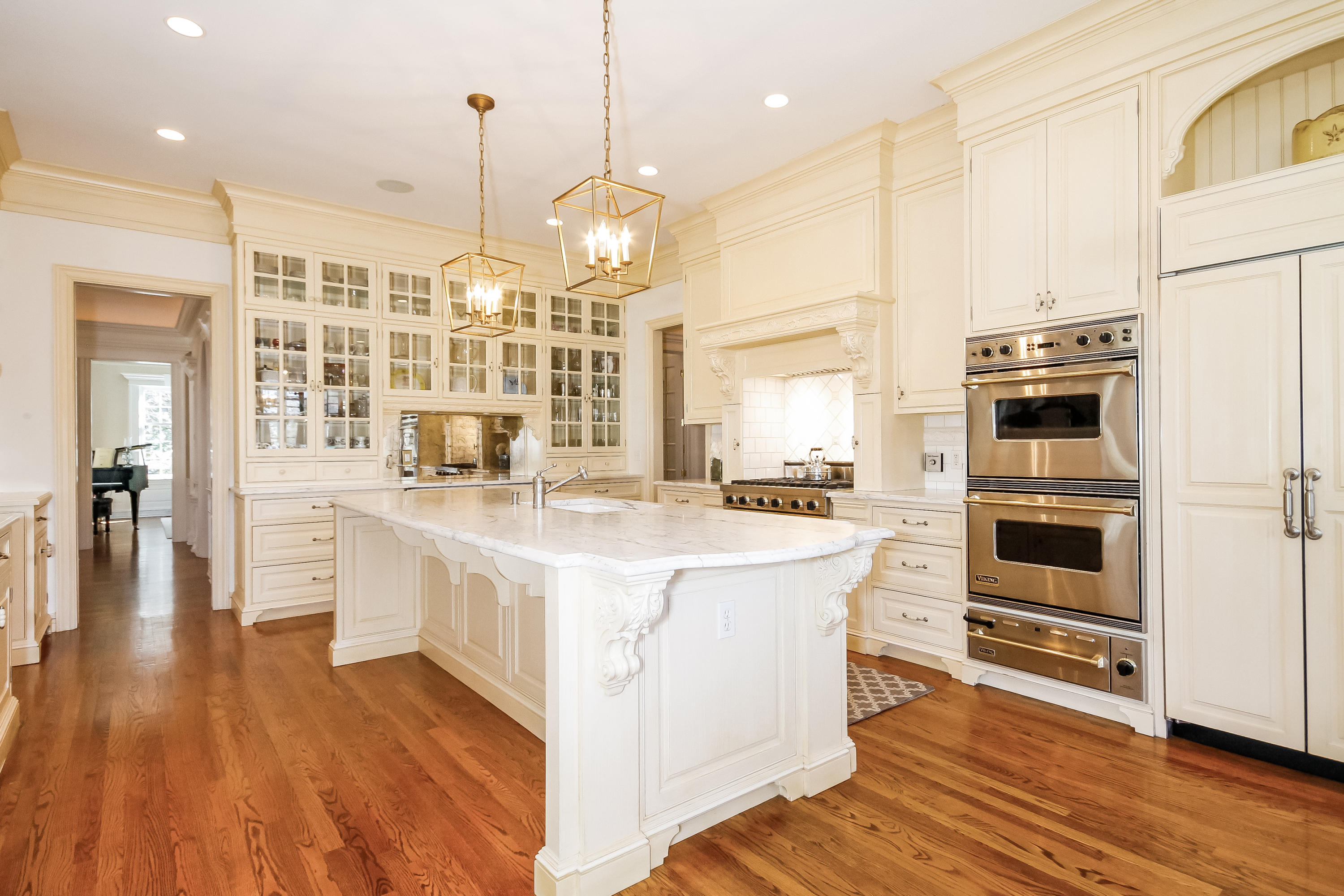17 Searles Road Darien, CT 06820 - Photo 11 of 36 a large white kitchen with wooden floor