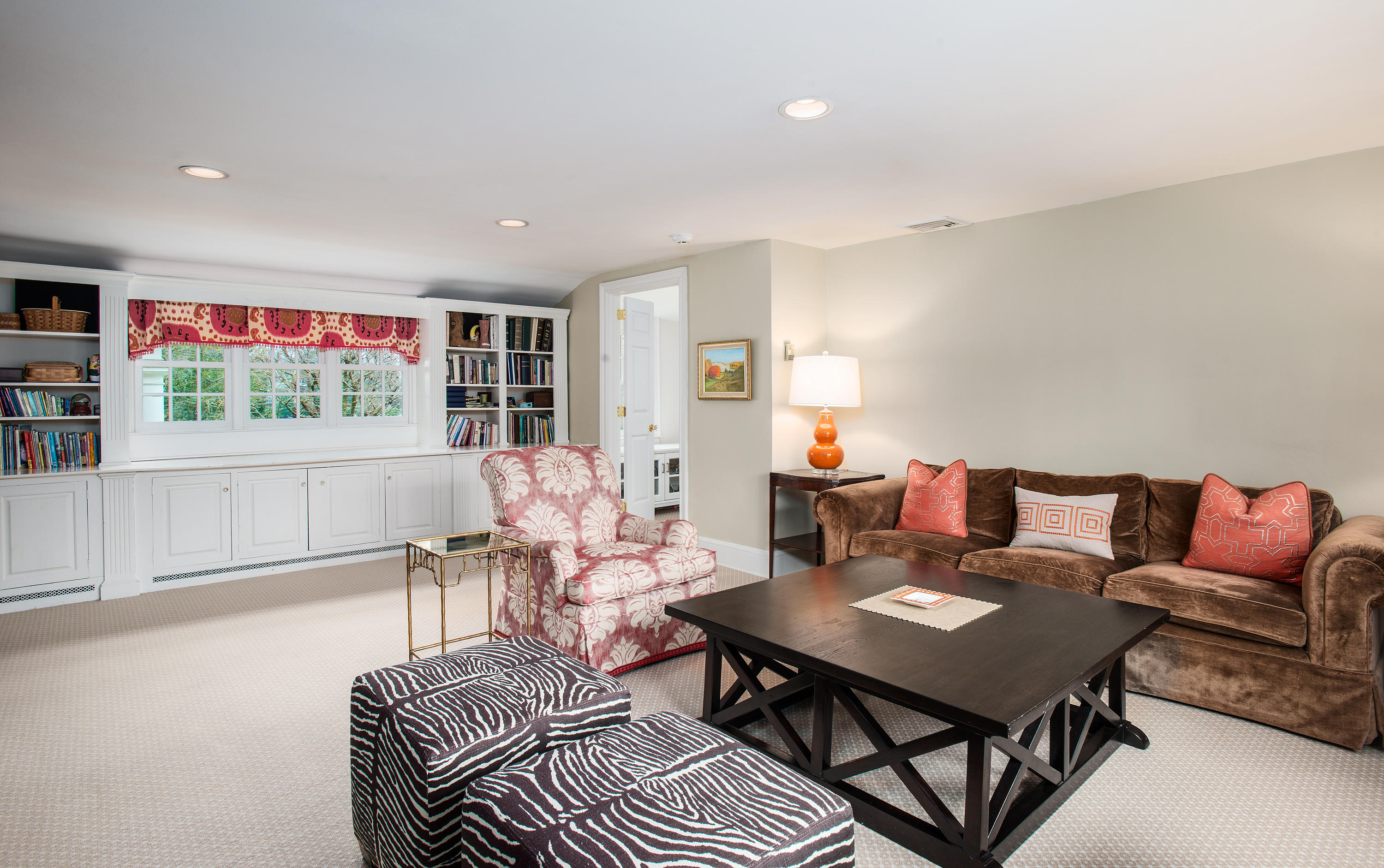 17 Searles Road Darien, CT 06820 - Photo 16 of 36 a living room with furniture a rug and a flat screen tv