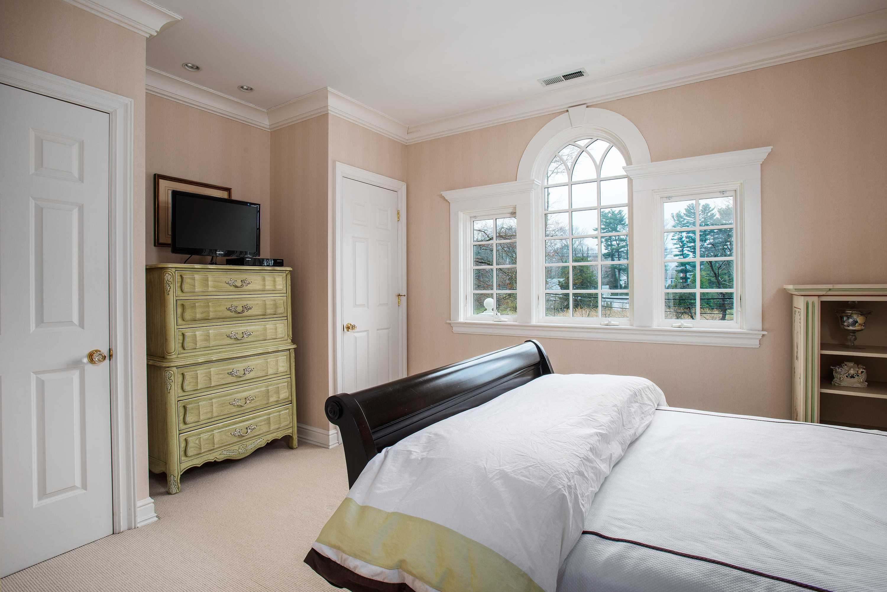 17 Searles Road Darien, CT 06820 - Photo 24 of 36 a bedroom with a bed and a television