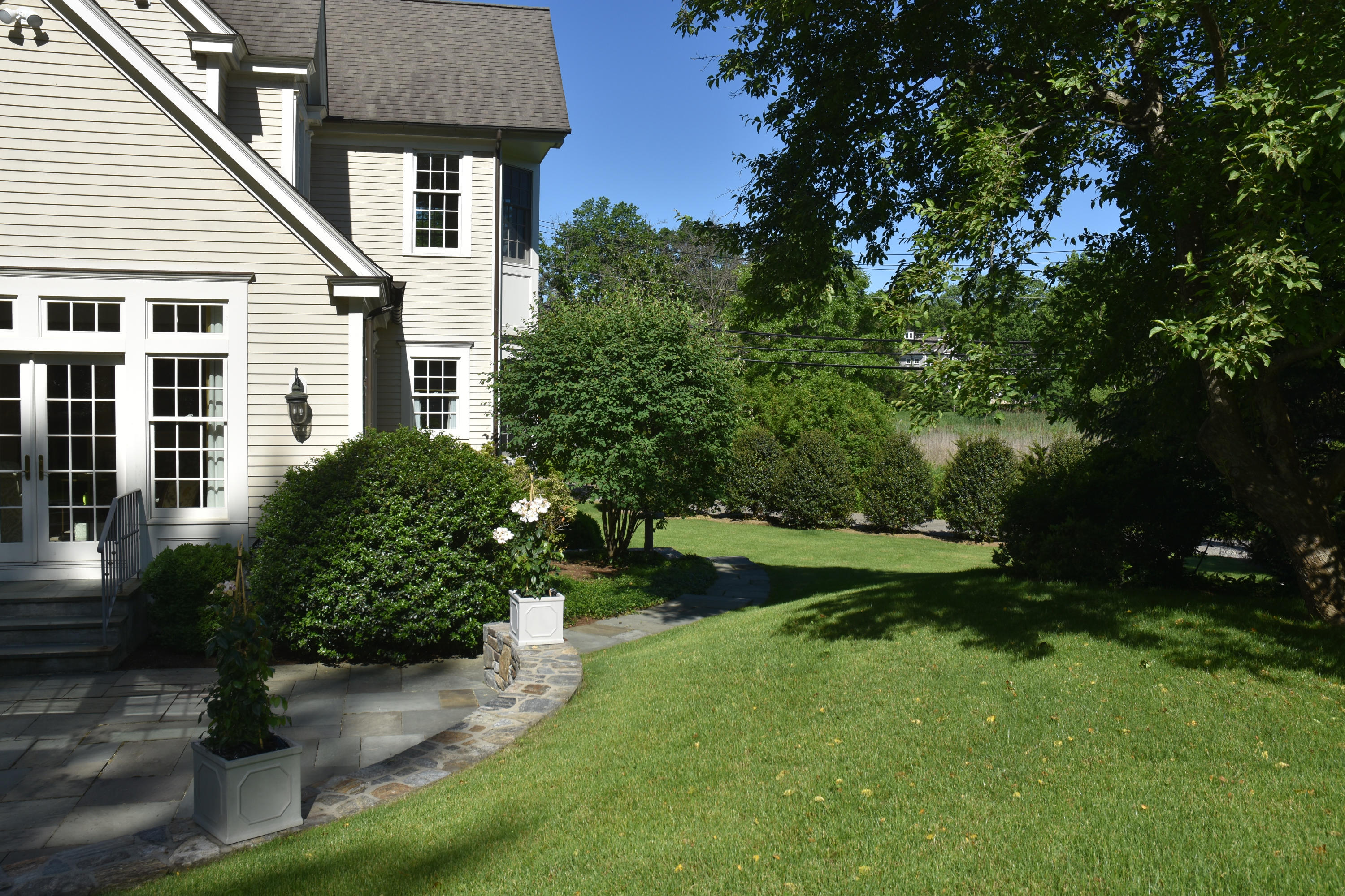 17 Searles Road Darien, CT 06820 - Photo 31 of 36 a front view of a house with garden
