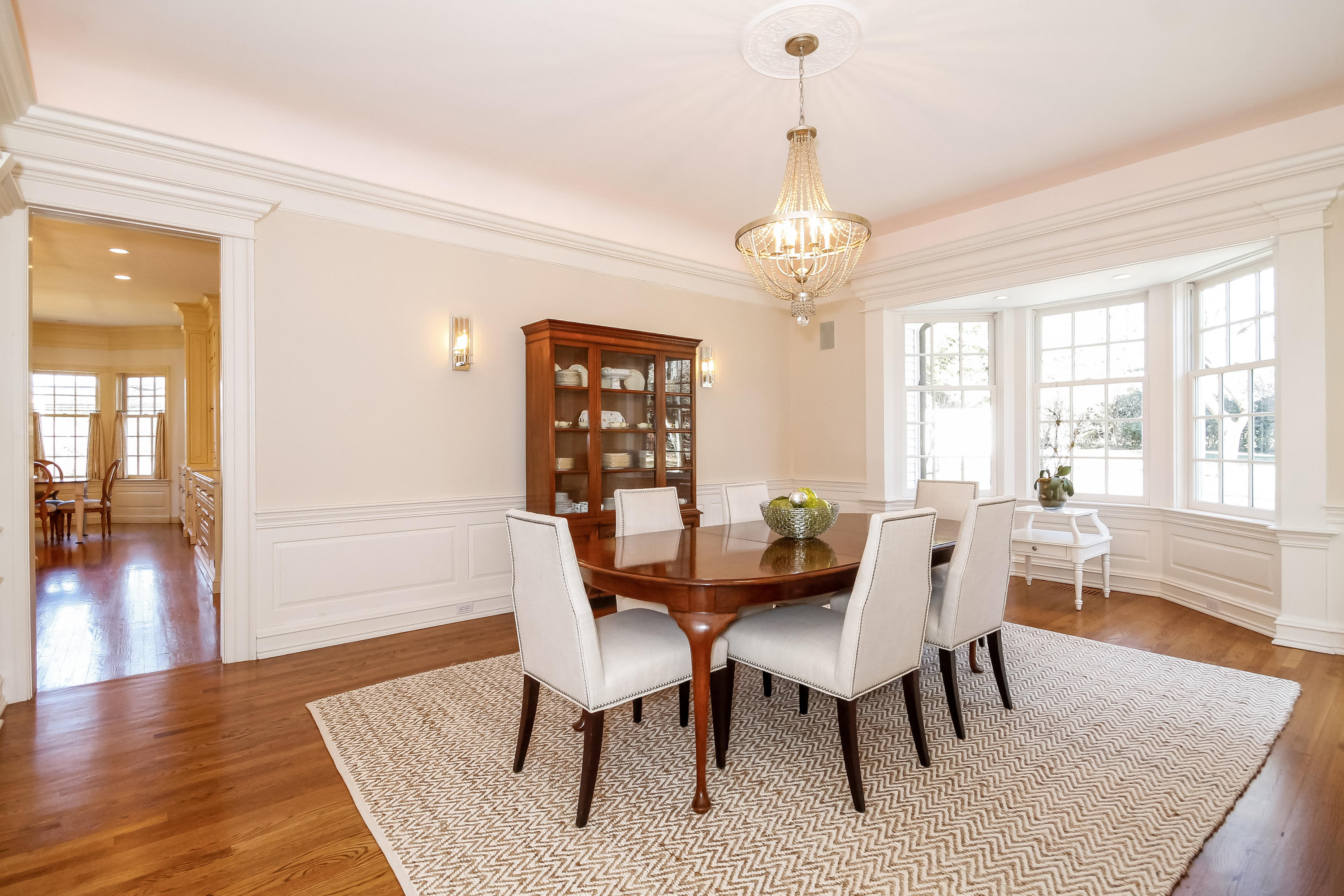 17 Searles Road Darien, CT 06820 - Photo 9 of 36 a view of a dining room with furniture window and wooden floor