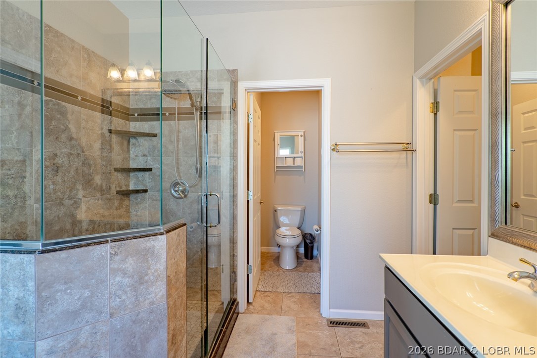 150 Cub Cove Point Camdenton, MO 65020 - Photo 29 of 89 Main level suite bath has private water closet