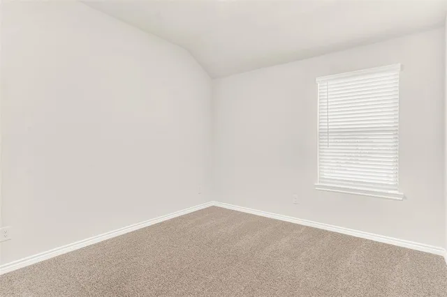 a bathroom with a sink a toilet a mirror and shower