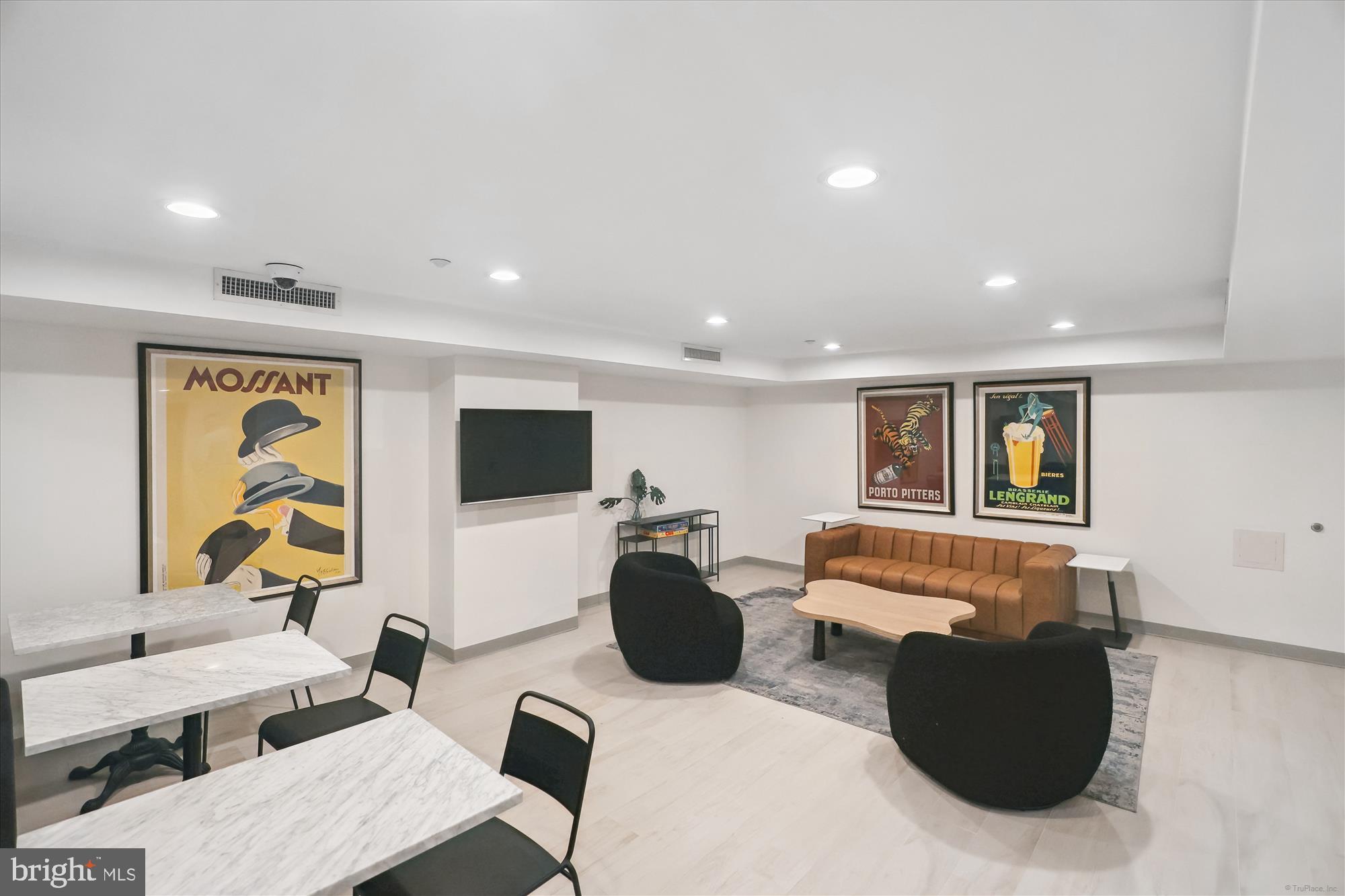 1150 K Street Northwest, Unit 706 Washington, DC 20005 - Photo 32 of 34 a living room with furniture and a flat screen tv