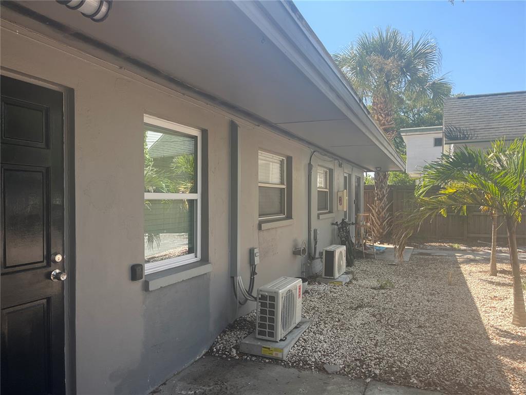 115 Cleveland Avenue Southwest Largo, FL 33770 - Photo 14 of 15 a living room with furniture and a potted plant