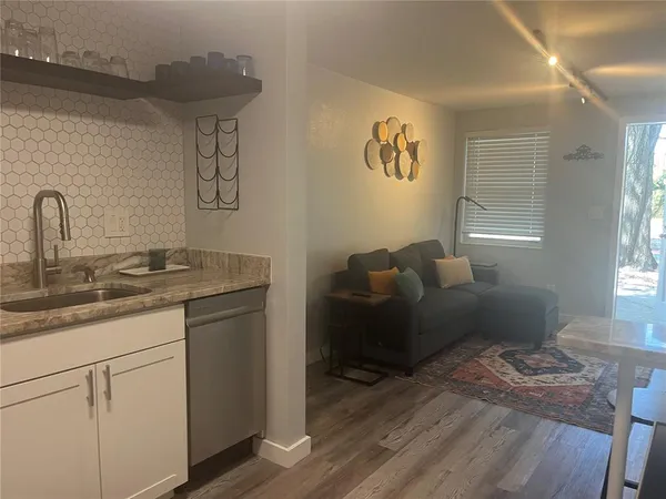 a living room with furniture and a table