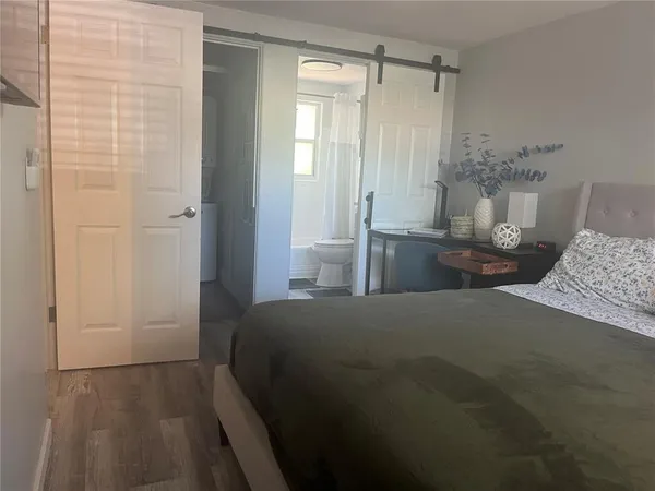 a bedroom with a bed and a table in it