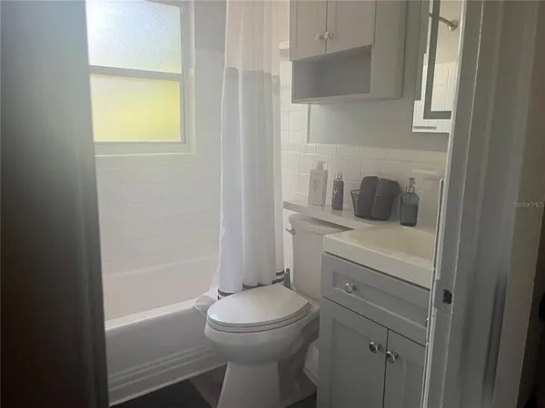 a bathroom with a toilet sink and bathtub