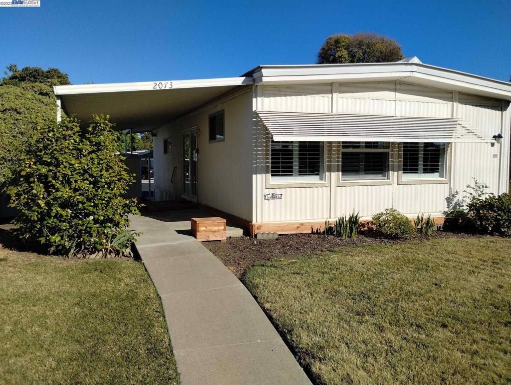 2073 Dalis Drive Concord, CA 94520 - Photo 1 of 15 a front view of a house with garden