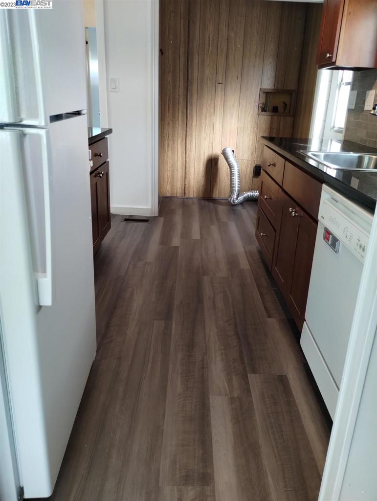 2073 Dalis Drive Concord, CA 94520 - Photo 8 of 15 a kitchen with sink a refrigerator and a stove