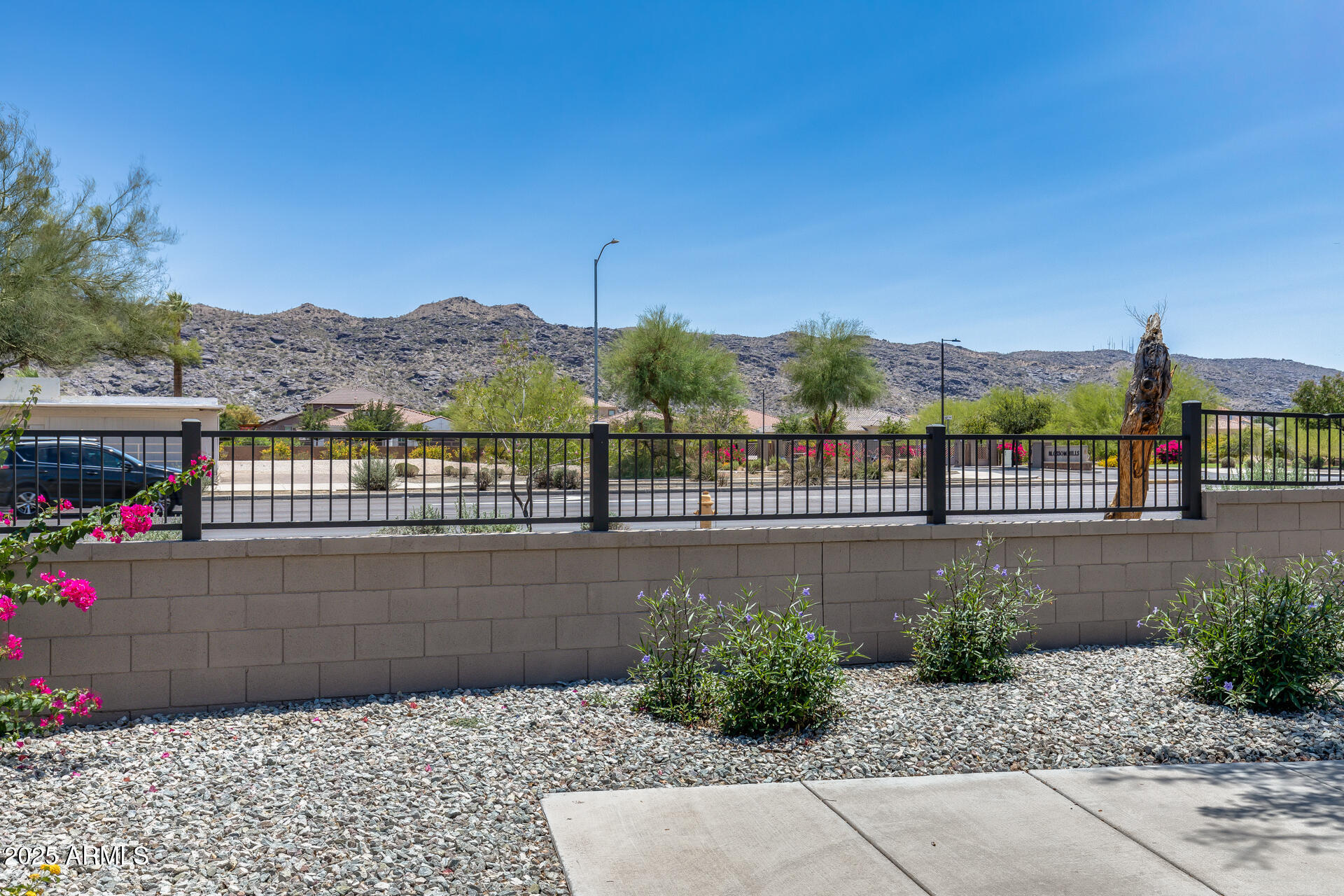 2941 East Darrow Street Phoenix, AZ 85042 - Photo 41 of 48 a view of a street with a bench in front of it