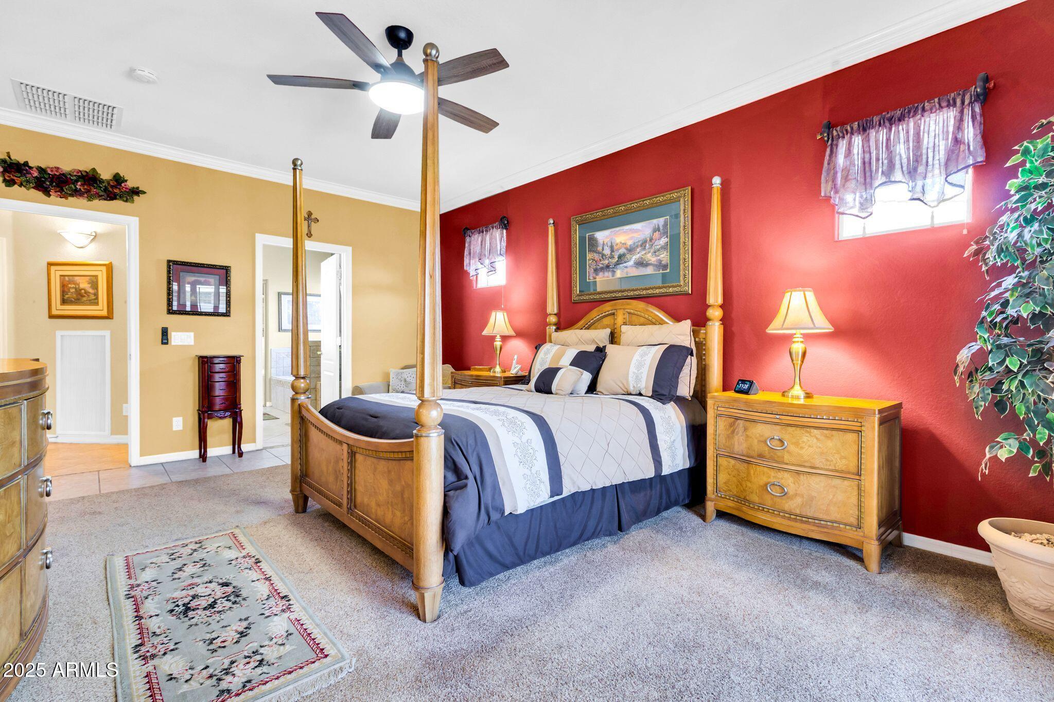 6959 South Rincon Drive Chandler, AZ 85249 - Photo 19 of 38 a bedroom with a bed and a chandelier