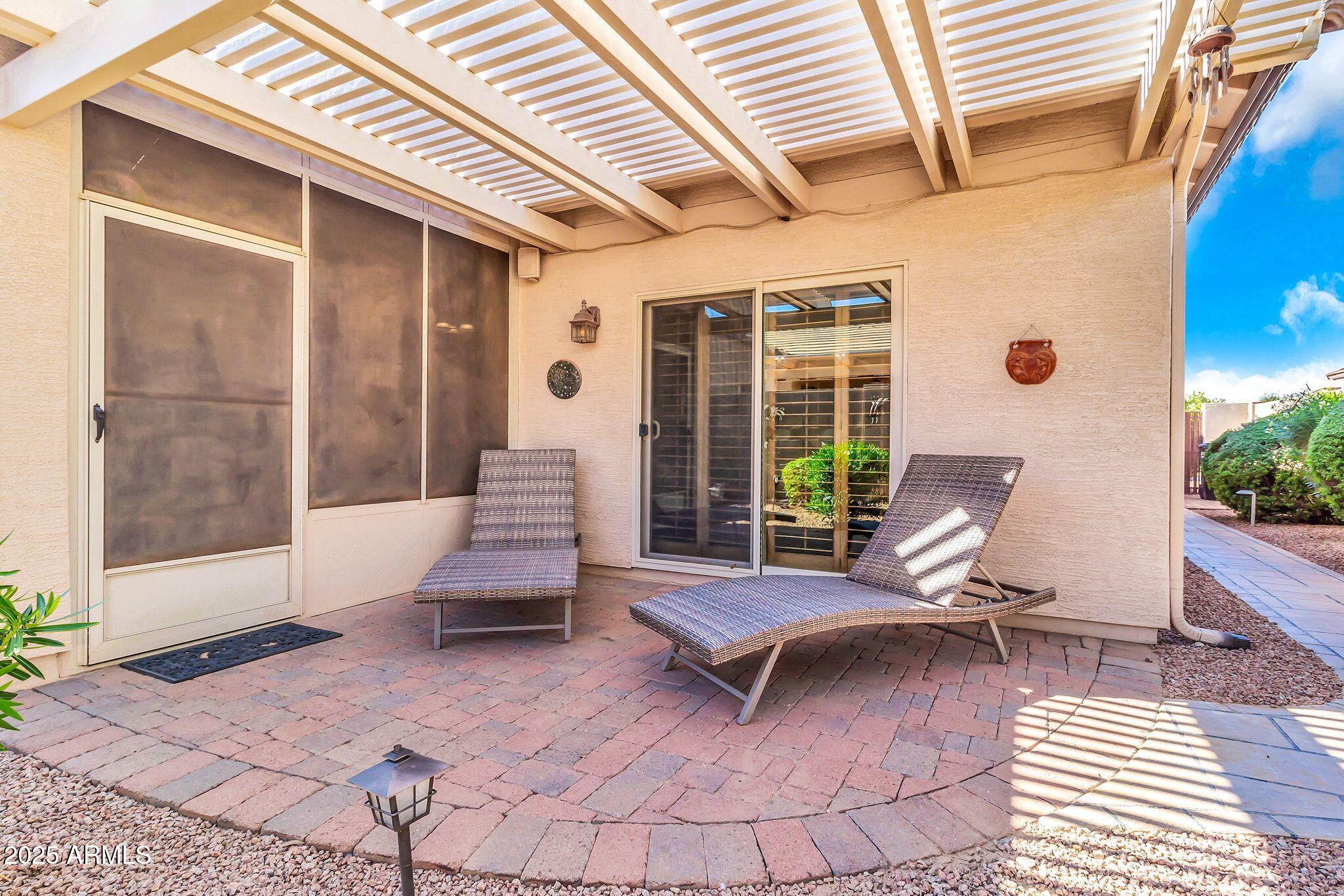 6959 South Rincon Drive Chandler, AZ 85249 - Photo 28 of 38 a view of a patio with a table and chairs
