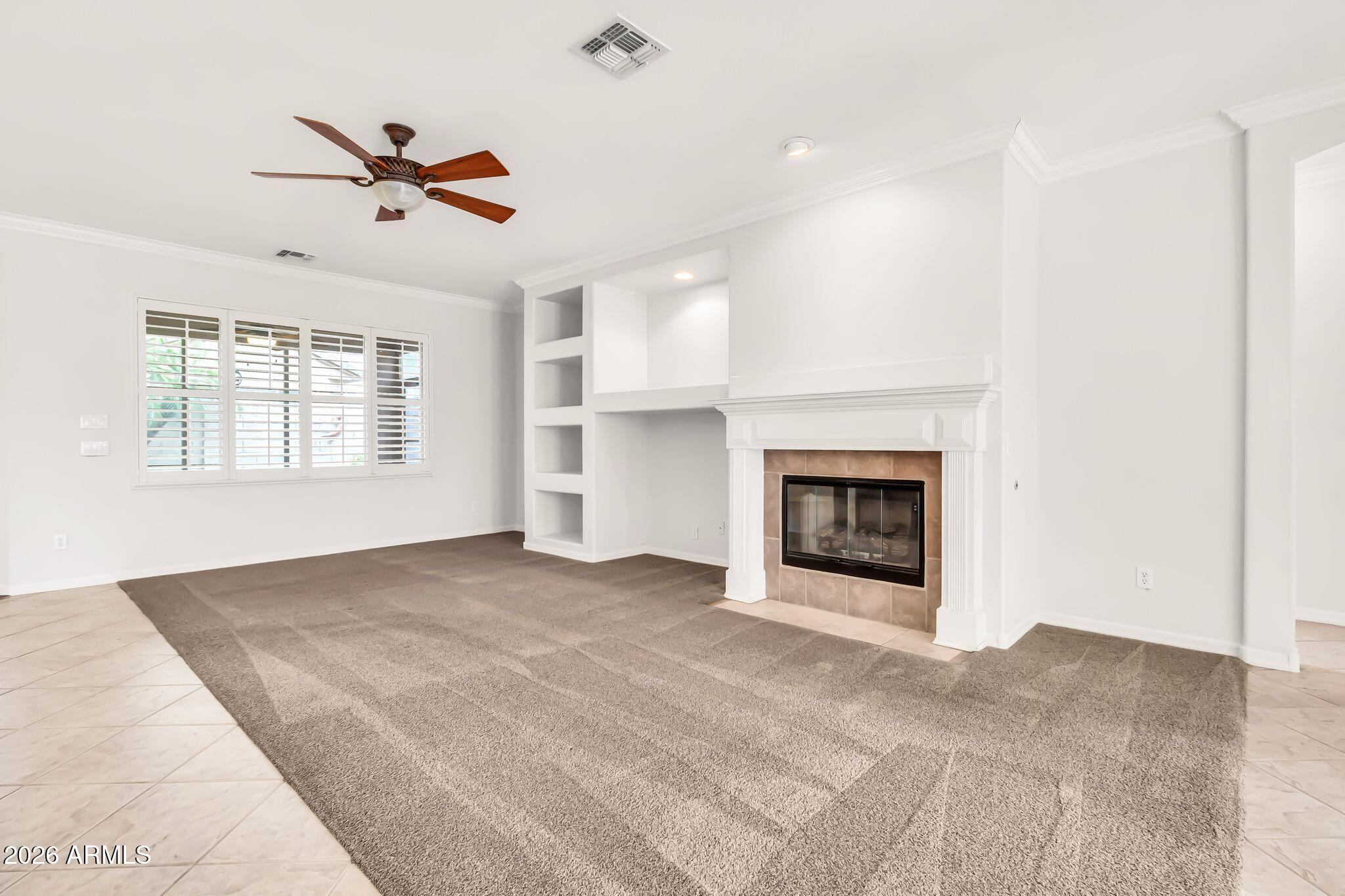 6959 South Rincon Drive Chandler, AZ 85249 - Photo 3 of 25 a view of an empty room with window and fireplace