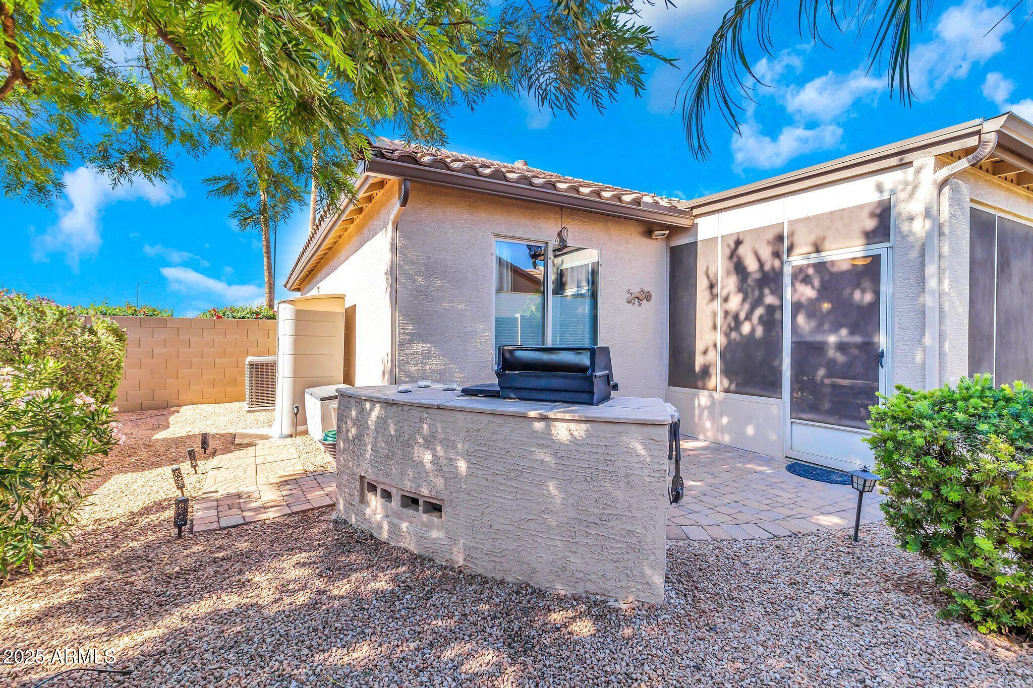 6959 South Rincon Drive Chandler, AZ 85249 - Photo 34 of 38 a view of outdoor sitting area with trees