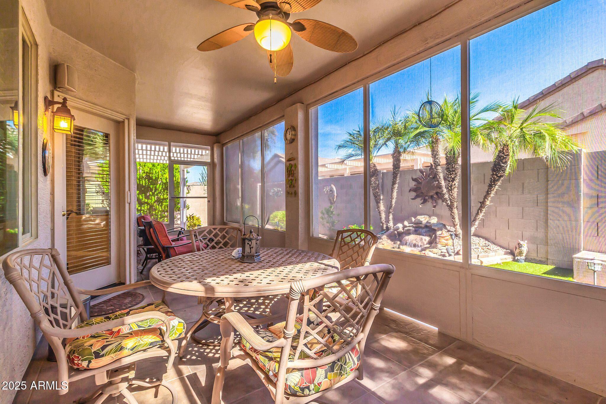 6959 South Rincon Drive Chandler, AZ 85249 - Photo 35 of 38 a living room with patio furniture and a large window