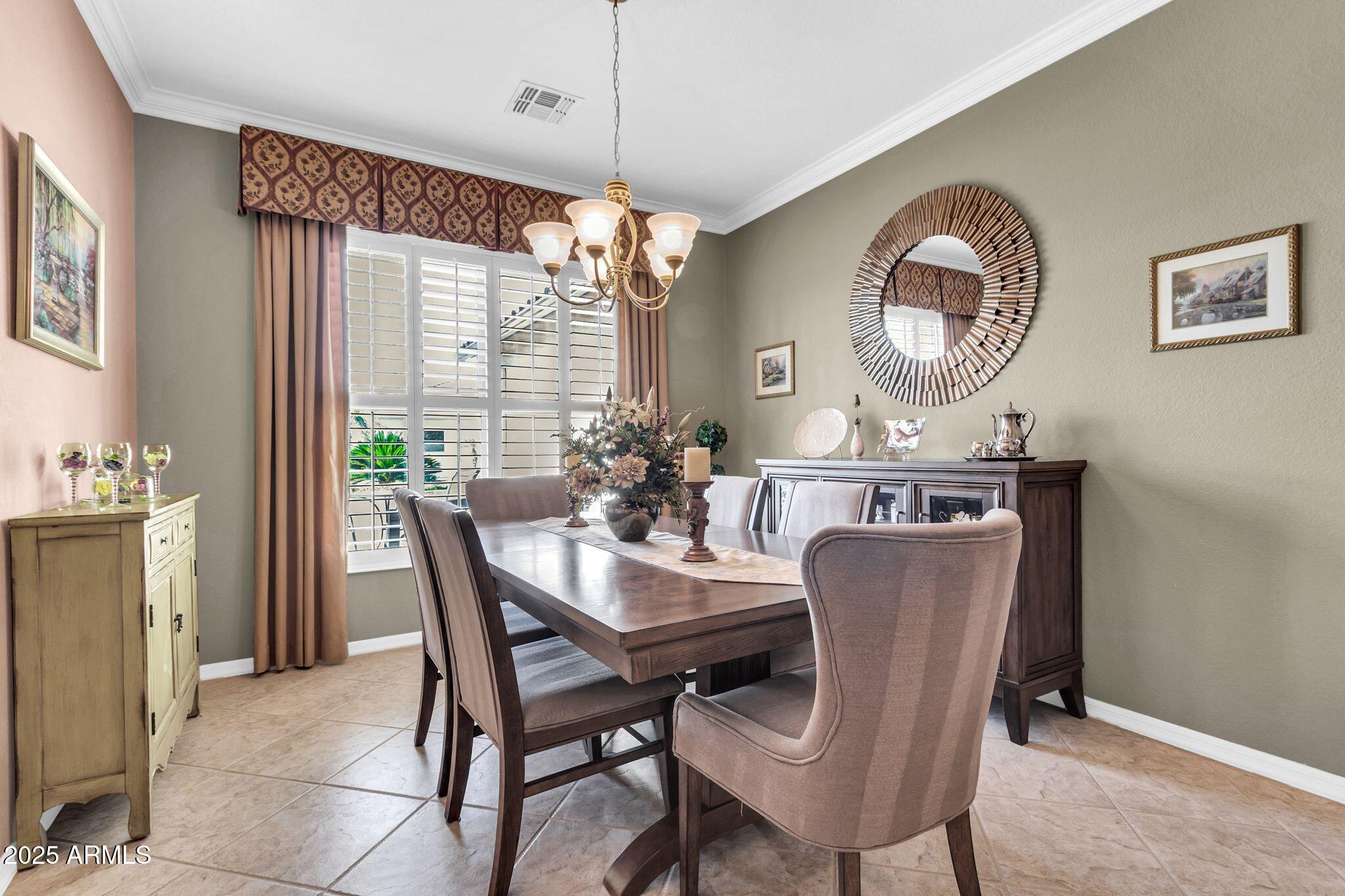 6959 South Rincon Drive Chandler, AZ 85249 - Photo 8 of 38 a view of a dining room with furniture window and wooden floor