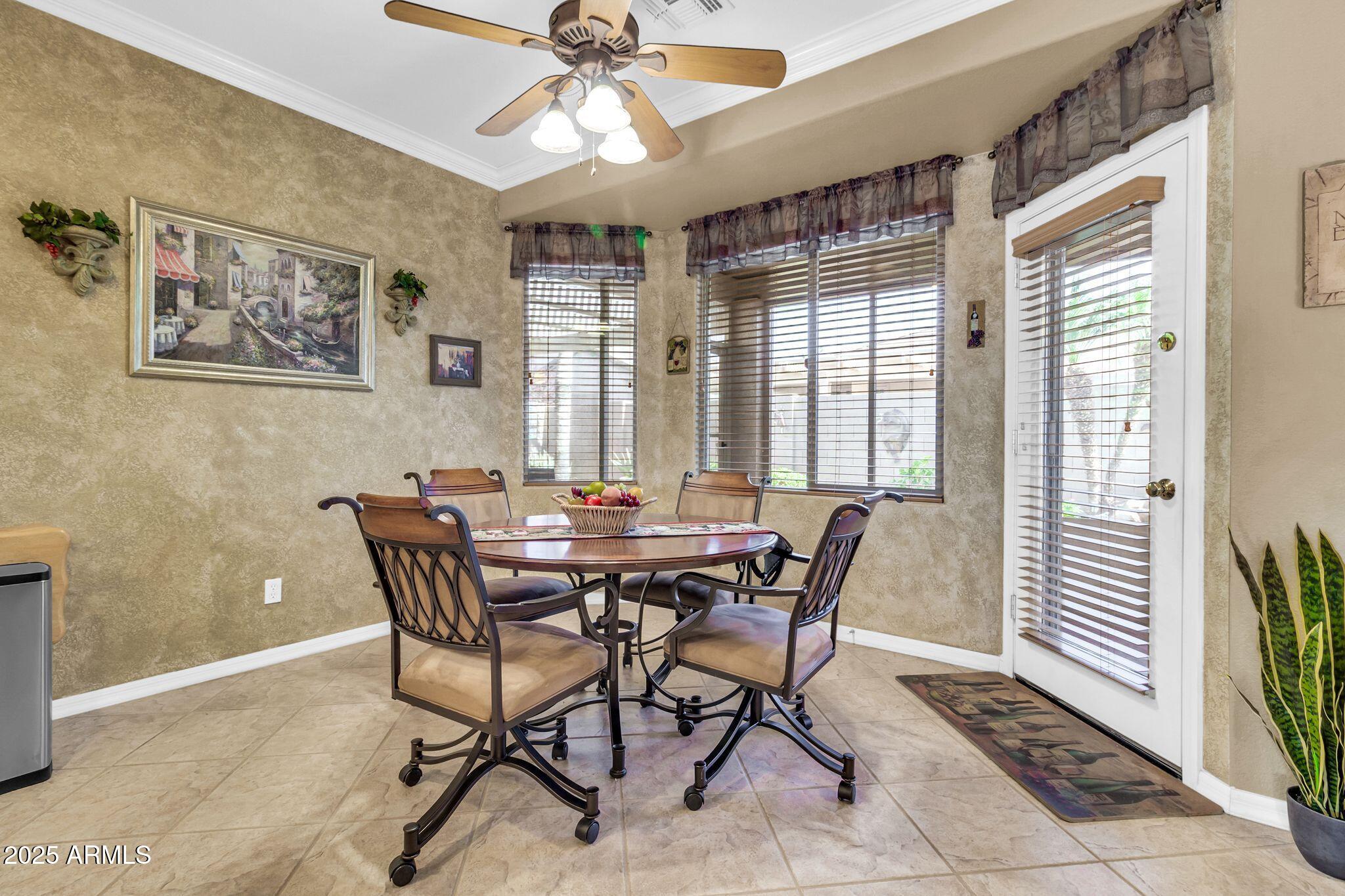 6959 South Rincon Drive Chandler, AZ 85249 - Photo 9 of 38 a view of a dining room with furniture and a chandelier
