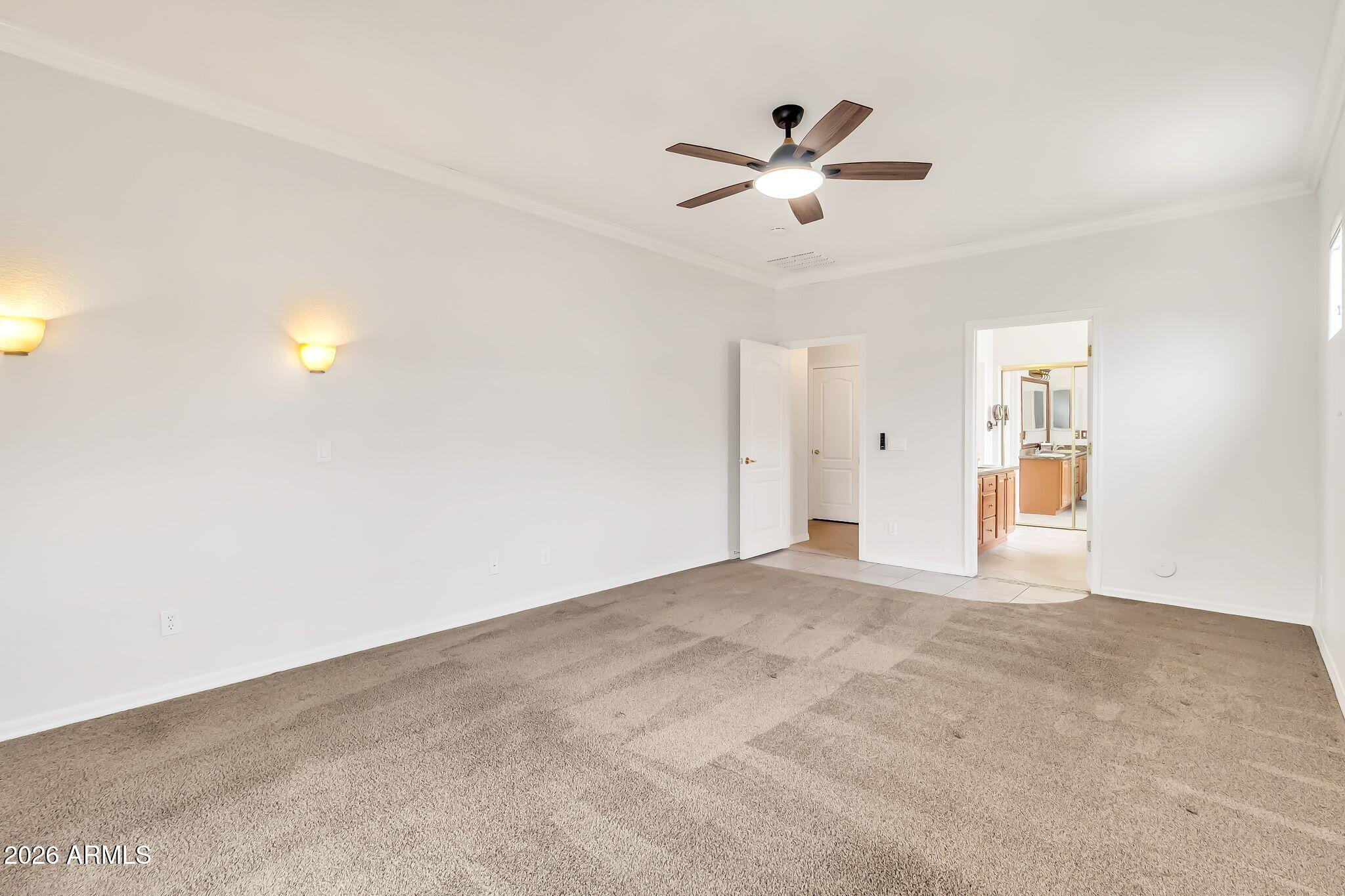 6959 South Rincon Drive Chandler, AZ 85249 - Photo 10 of 25 a view of an empty room with chandelier fan