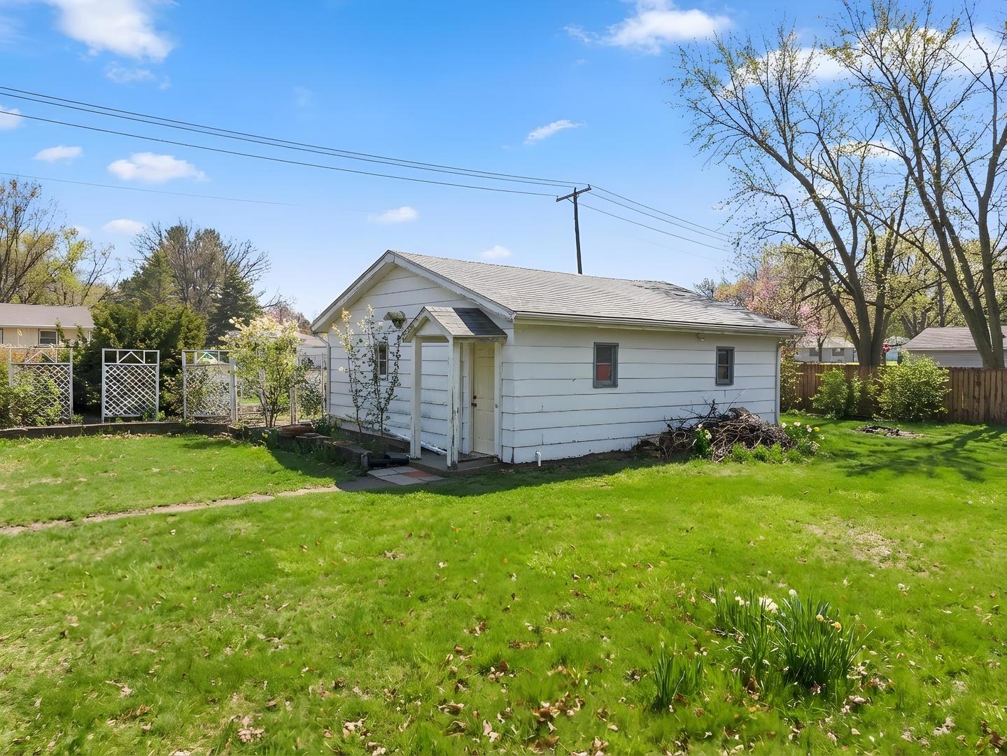 200 Ramona Avenue Rochelle, IL 61068 - Photo 4 of 21 a view of a yard in front of house