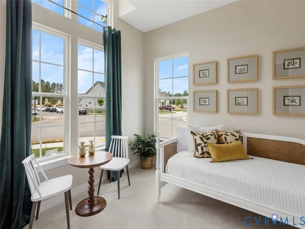 a bedroom with furniture and a window