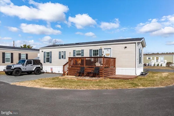 a view of a house with swimming pool and porch