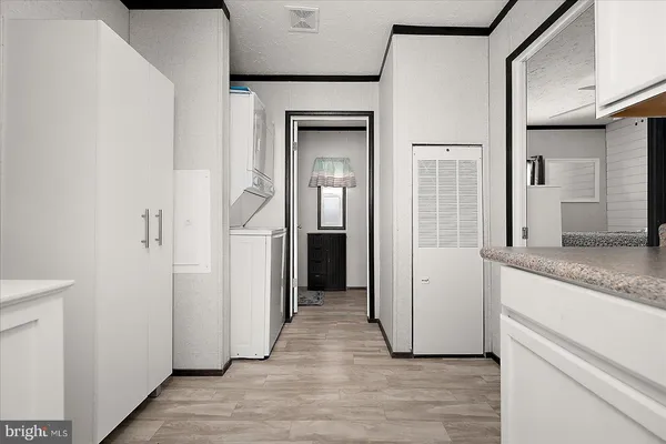 a view of hallway with wooden floor