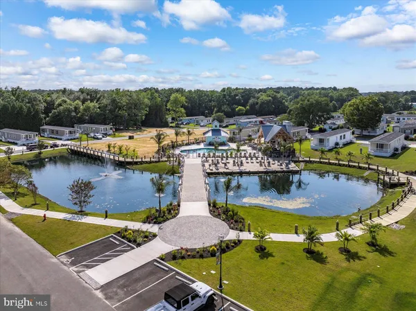 a view of a swimming pool with lawn chairs
