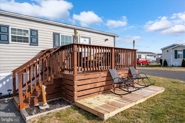 a view of a patio with a table and chairs