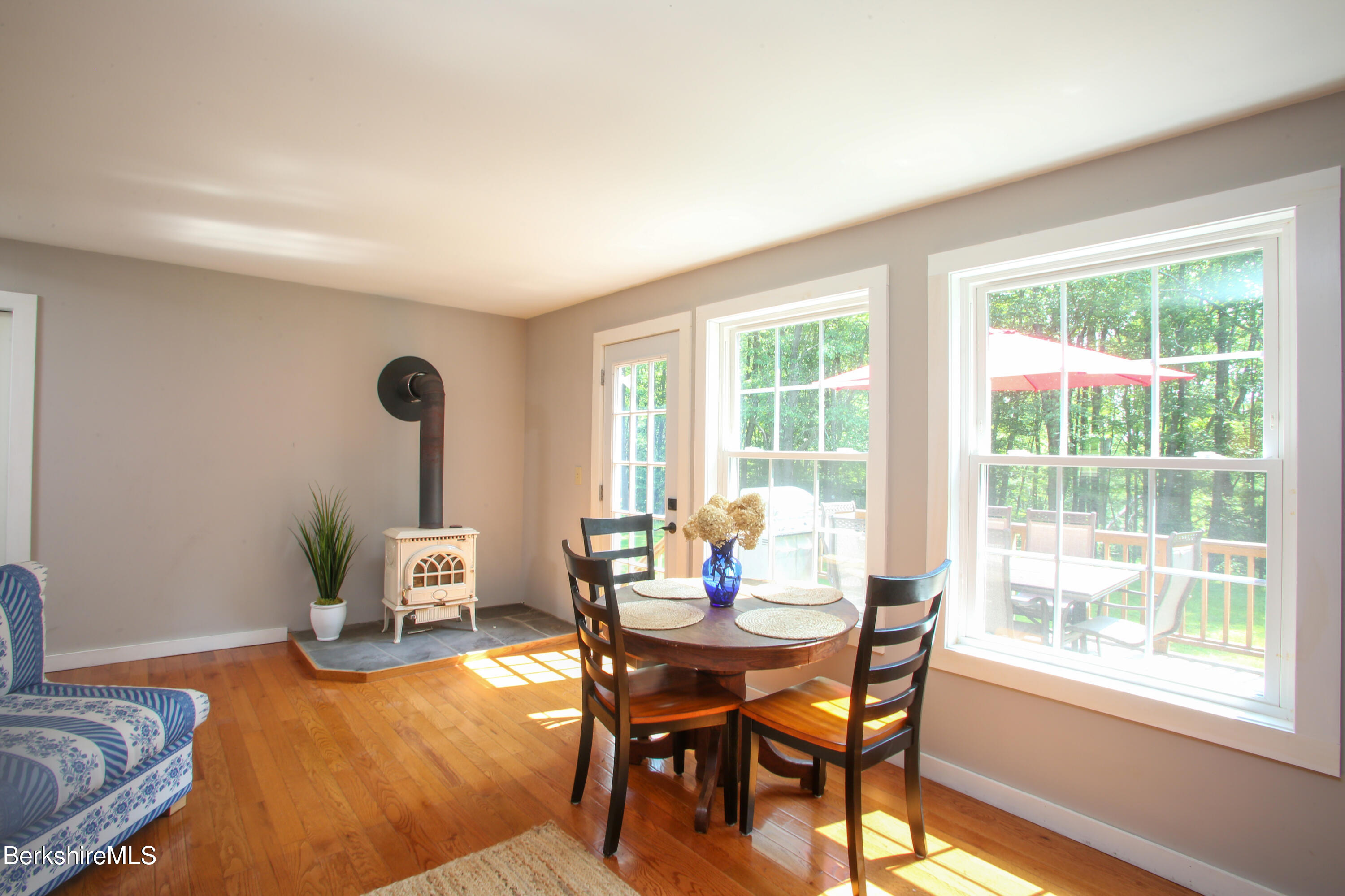 127 County Road Rowe, MA 01367 - Photo 10 of 29 a dining room with furniture mountain view and a floor to ceiling window